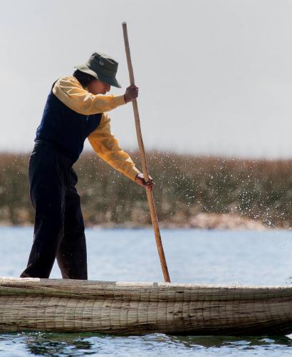 Maintaining the balance on an Uros Island reed canoe